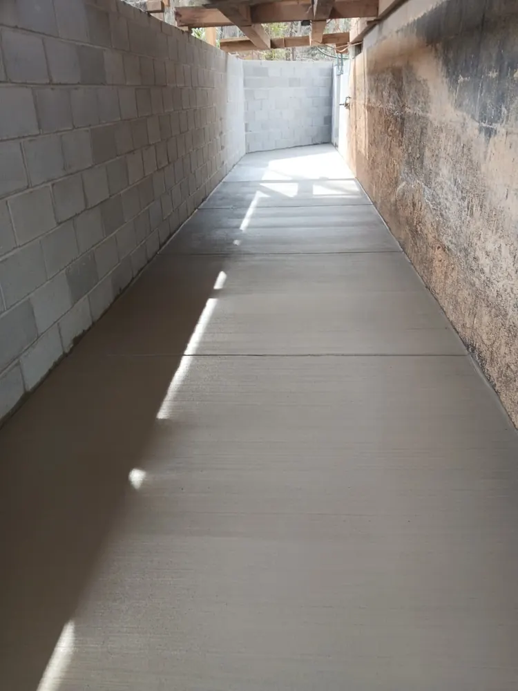 Commercial concrete walkway poured between block walls, NC foothills