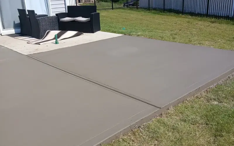 Backyard concrete patio with furniture, Yadkin County NC