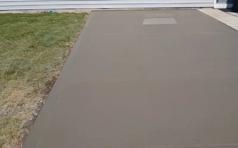 Finished decorative concrete patio behind a home, Yadkin County NC