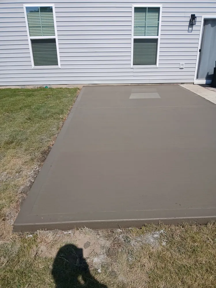 Finished decorative concrete patio behind a home, Yadkin County NC
